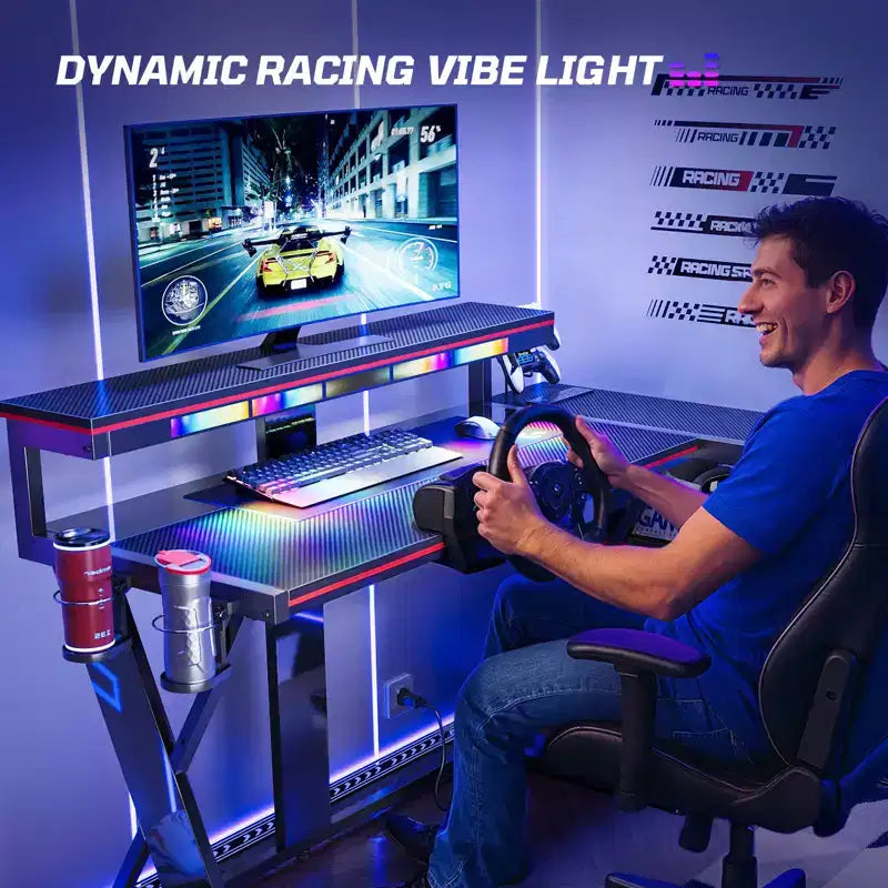 Scrivania da gaming a L con luce LED, supporto per monitor e presa di corrente – Nero/Viola, 42"/57", 1 persona