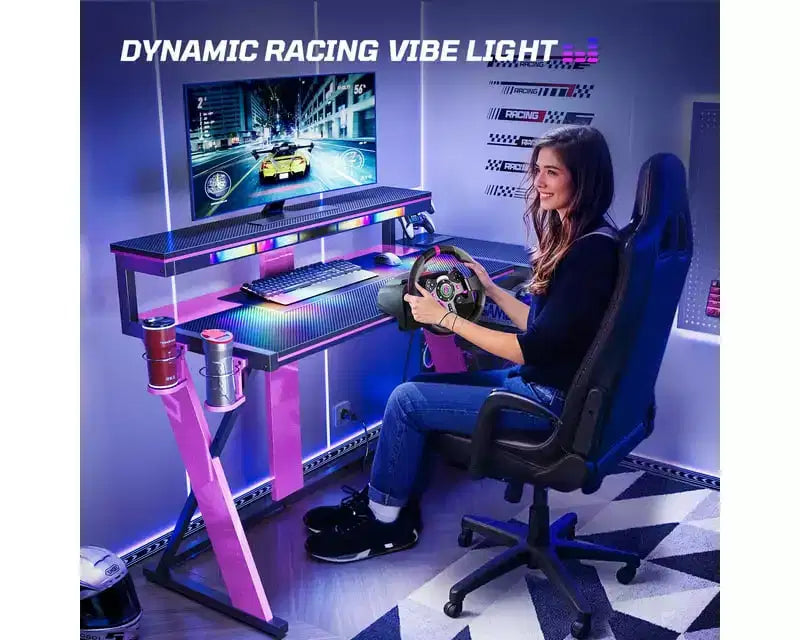 Scrivania da gaming a L con luce LED, supporto per monitor e presa di corrente – Nero/Viola, 42"/57", 1 persona