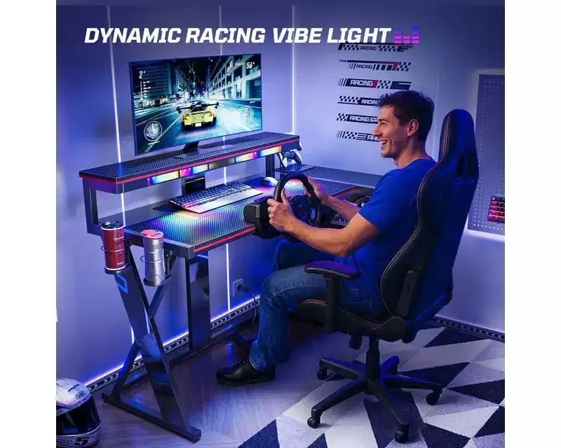Scrivania da gaming a L con luce LED, supporto per monitor e presa di corrente – Nero/Viola, 42"/57", 1 persona