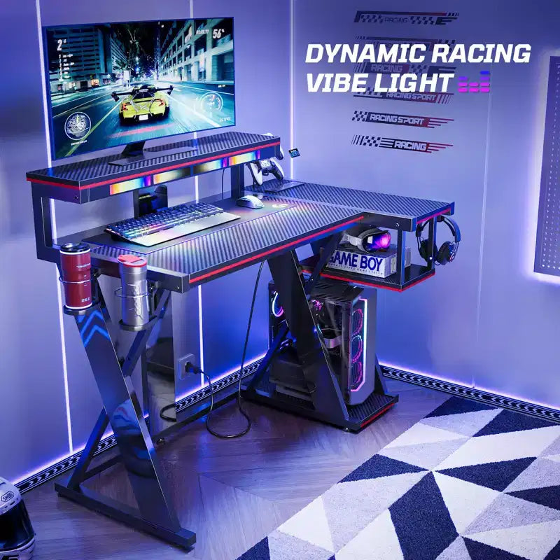 Scrivania da gaming a L con luce LED, supporto per monitor e presa di corrente – Nero/Viola, 42"/57", 1 persona